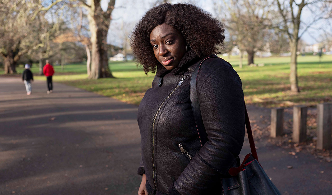 Abigail in the park looking directly at the photographer