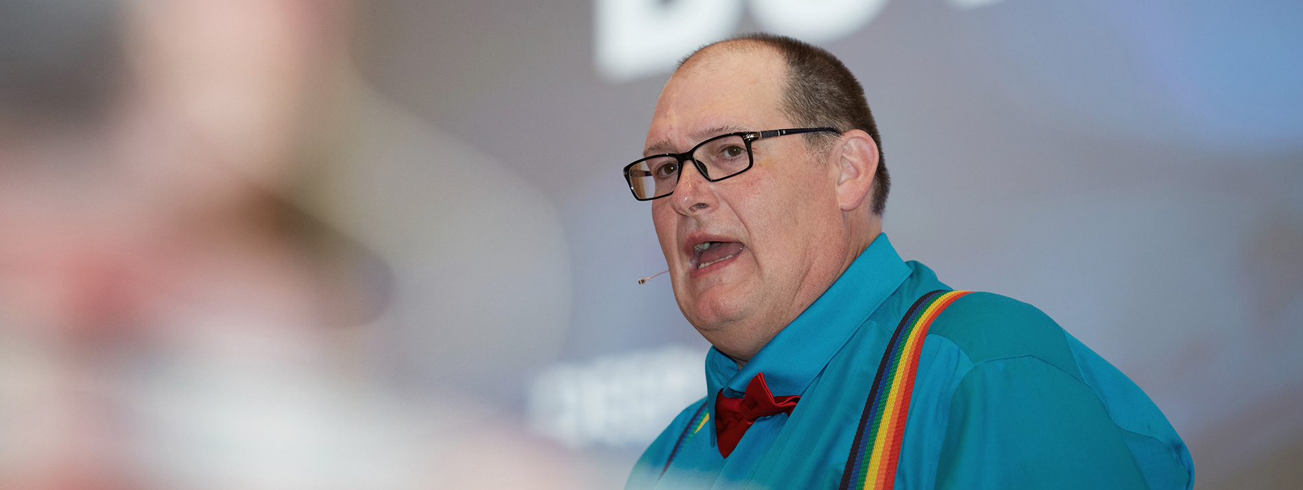 A man in the middle of a talk during a presentation.